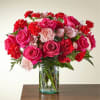 Hot pink roses, carnations, and spray roses arranged beautifully together. 