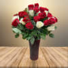 Rose Petal Delights is a stunning floral arrangement featuring 36 roses. This