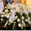 A mix of white flowers to create this beautiful white casket spray.