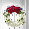 Wreath, roses, carnations, blue delphinium