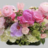 Captivating arrangement filled with mixed shades of pink roses, pink  tulips
