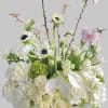This big white fresh arrangement has a touch of blush pink tree