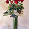 long stem dozen red roses with touch of green cymbidium in a
