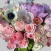 Pretty pink roses, tulips, peonies, anemones, hydrangeas, cymbidium orchids in a leaf