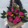 This is a hand tied bouquet that has a mix of roses