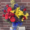 In a mix of primary colors, this bright arrangement designed by one