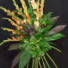 This standing spray features a fan of gladiolus and aspidistra mixed with