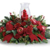 Shiny red apples and all kinds of holiday flowers and features make