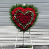 Remember a loved one&#039;s generous heart with this red arrangement in a