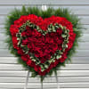 Remember a loved one&#039;s generous heart with this red arrangement in a