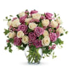 Romance blossoms beautifully within this elegant bouquet. The serenity and innocence of