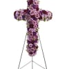 A breathtaking standing cross of majestic purple and lavender blooms remembers and