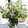 Beautiful blend of California locally grown flowers arranged in the glass vase
