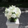 A mix of all whites and ivories including hydrangea, roses, lisianthus and