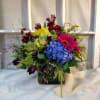 Classic custom bouquet of seasonal flowers with hydrangea, cymbidium orchids, tulips, stock