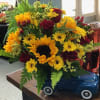 Ford truck with sunflowers and red roses
