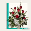 A nice mix of red and white flowers designed in a container.