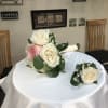 Roses, baby&#039;s breath and greenery.