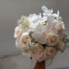 Royal white phalaenopsis orchid, white roses, carnations and baby&#039;s breath well rounded