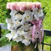 White and pink mix of flowers from delicate orchids and roses symbolize