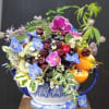 Create arrangement in Victorian style container used edible berries citrus including fresh