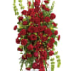 This elegant, all red funeral spray conveys compassion and deep devotion. Presented
