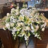 All white mixed flowers in greens that belong in the heavens 