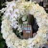 This large classic wreath is delivered on an easel, and is a