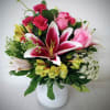 Send your best wishes with stargazers, alstroemeria, mini carnations and roses. Arranged