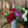 Delightful Assortment of Seasonal Blooms Highlighted with Evergreens in a Keepsake Corrugated
