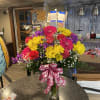 This arrangement is made with bright Gerber Daisys and reg yellow daisys