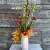 Mini pumpkins with red gladiolus green bells of Ireland and touches of
