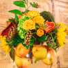 Celebrate the fall harvest season with an arrangement of roses and spray