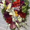 Mixed flowers with some tropicals funeral heart