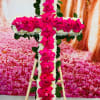 This is a beautiful Medium Cross with hot pink roses.