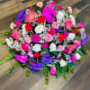 This is a medium casket with roses, and mix flowers.