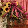 We will create a beautiful casket spray for your loved one. 