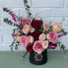 This beautiful box is filled with english roses, ranunculus and a variety