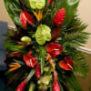 With birds of paradise, fresh ginger, red and green antherium, a touch