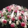 This casket spray make with white orchids , pink and white roses