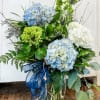 White, green and blue hydrangeas are the stars of this bouquet.