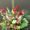 The Tropical arrangement make with bird of paradise ,  ginger, roses