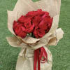 12 red Roses  wrapped in newspaper  Glass vase not included