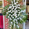 White is the color of elegance and reverence and this standing spray
