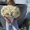 White round box with flowers arrangement. This gorgeous box with white roses