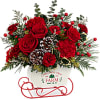 All aboard for Christmas fun! This sweet metal sled joyfully delivers a