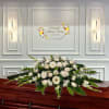 Naturally Elegant Casket Spray
Shown in white, but colors can be customized, indicate