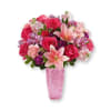 Bright arrangement of hot pink roses, asiatic lilies, carnations, and more. Artfully