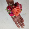 Beautiful orange Sahara rose with pink anemones wrist corsage 