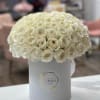 Bring beauty to the table with elegant arrangement, presented in a hat